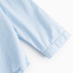 Striped shirt sleeves in light blue and white with button cuffs.