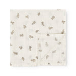 Stuffed 2-pack folded square in cream with repeated teddy bear print.