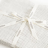 Dustproof bundle with straps and MarMar logos, small black dots on white background