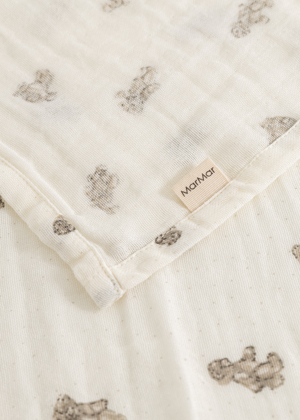 Baby ones in cream with teddy bear print, stitching and Marmar label
