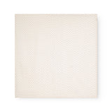 Baby ones laid flat in cream color with a subtle pink flower/ polka dot pattern.