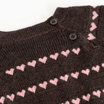 Sort striped blouse with pink hearts and buttons at the neckline.
