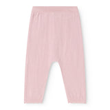 Pink knit trousers with elastic waist and relaxed fit.