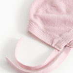 Pink knit hat in knit with folded edge and two drawstrings