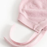 Pink knit hat in knit with folded edge and two drawstrings