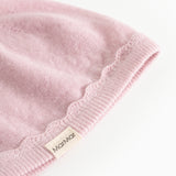 Pink striped hat in knit with wavy rib edge and side label.