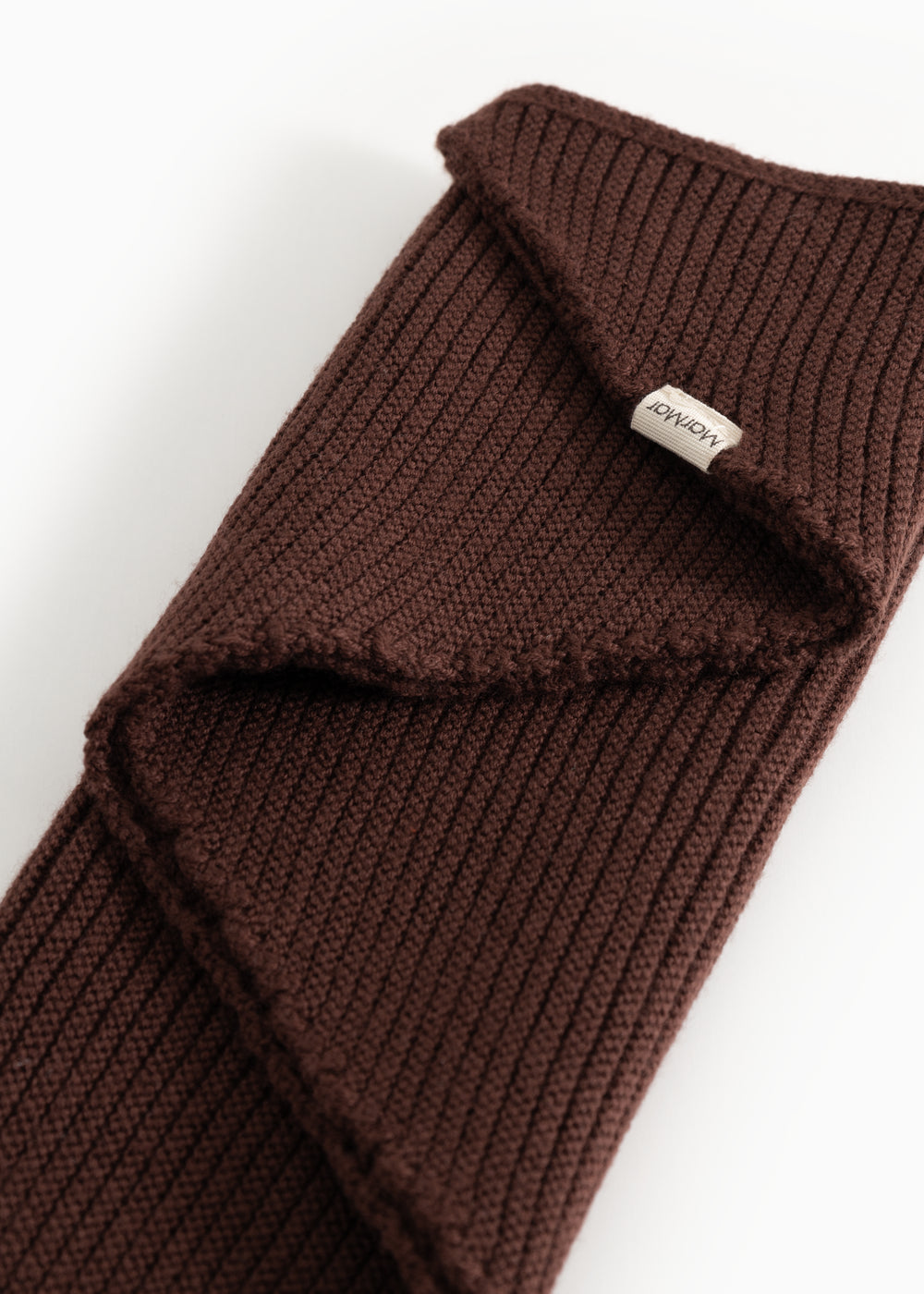 Dark wine-red knitted scarf with folded edge and Marmar label.