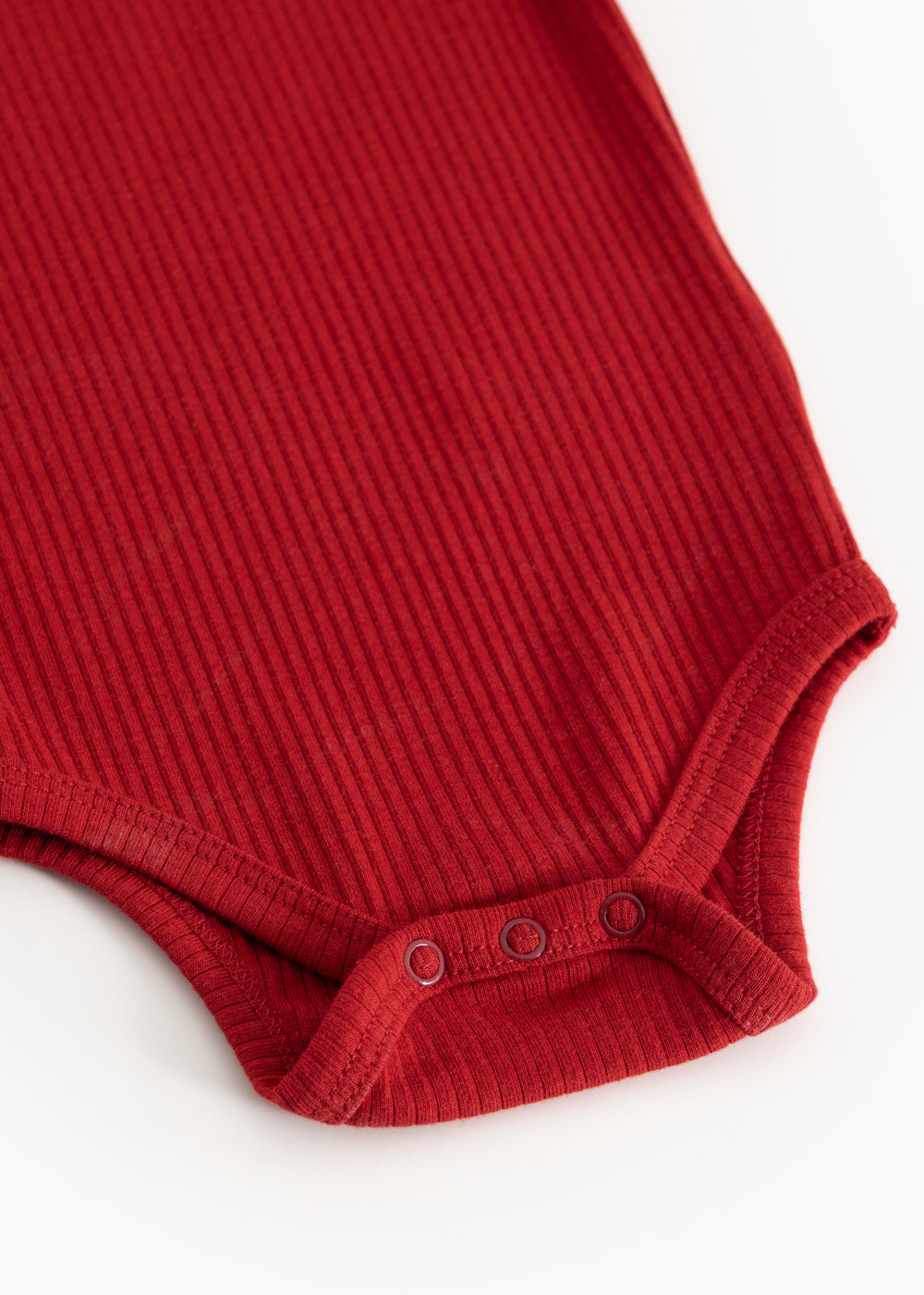 Red ribbed bodystocking with buttons at the crotch and soft leg edges