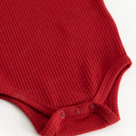 Red ribbed bodystocking with buttons at the crotch and soft leg edges