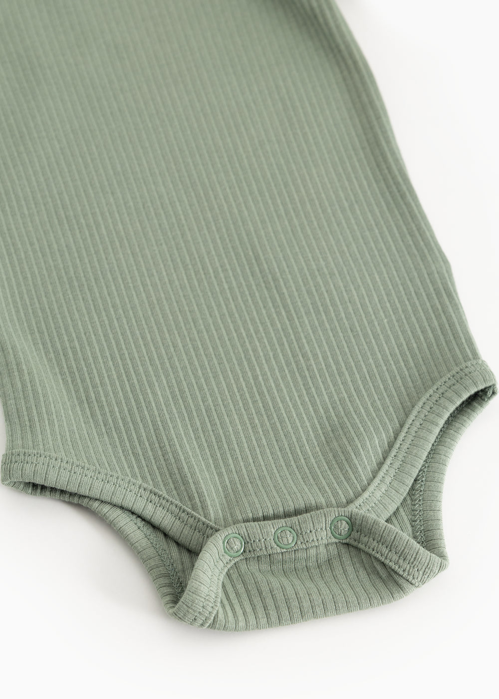Green ribbed bodystocking with snap buttons at leg opening