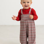 Romper with red stripes and shoulder straps, worn by a small child