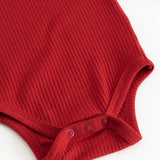 Red ribbed long-sleeve bodysuit with snap buttons at the crotch and hem