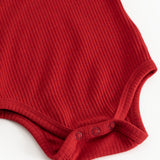 Cherry red bodystocking with ribbed pattern and snap buttons at the crotch.