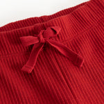 Detail of cherry red Pitti trousers with a drawstring at the waist