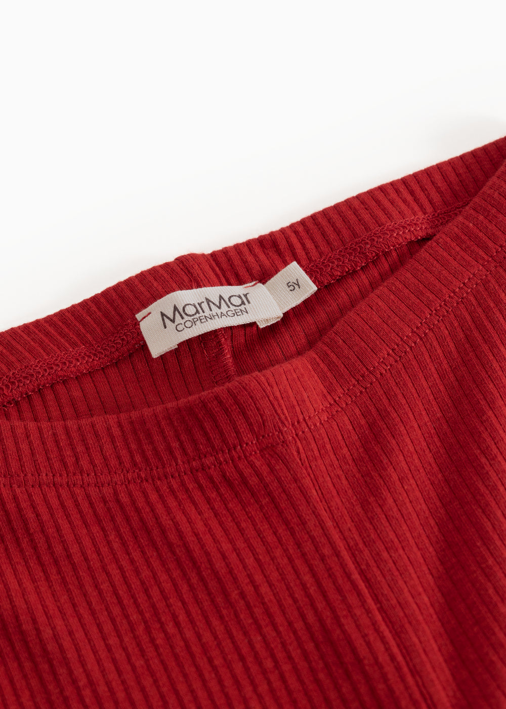 Red leggings for children with Miramar ClassicCare label on the waistband