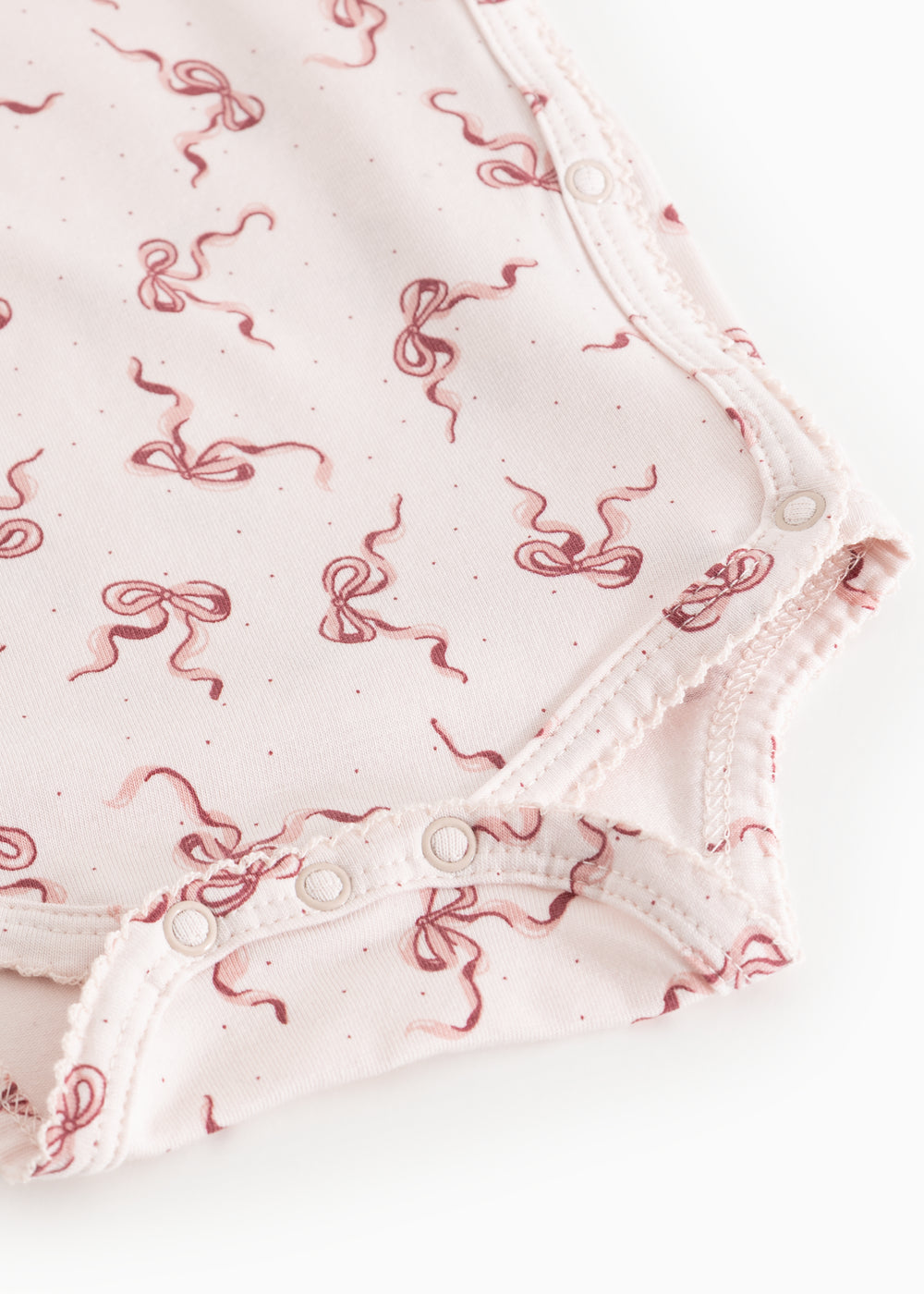 Belita bodystocking with snap buttons at the crotch and bow print