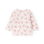 Pink blouse with seahorse pattern and long sleeves, round neckline