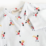 White jumpsuit with neckline and all-over musician pattern, close stitching.