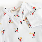 White jumpsuit with neckline and all-over musician pattern, close stitching.