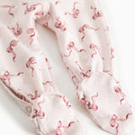 Light jumpsuit with all-over red bow pattern and long sleeves