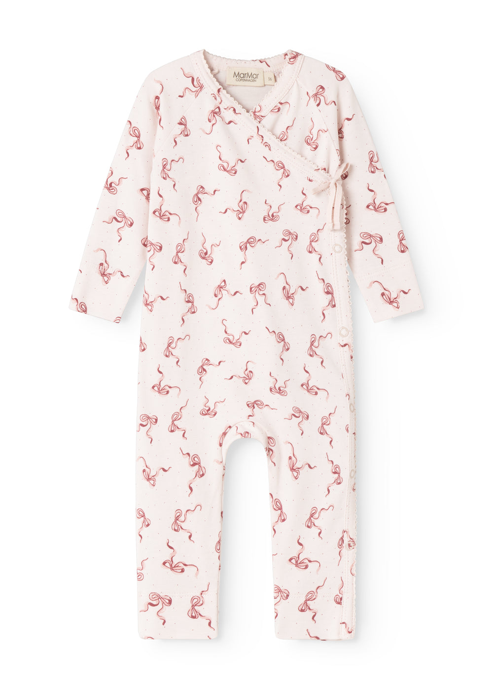 White jumpsuit with red bow ornament print and button closure at the neck