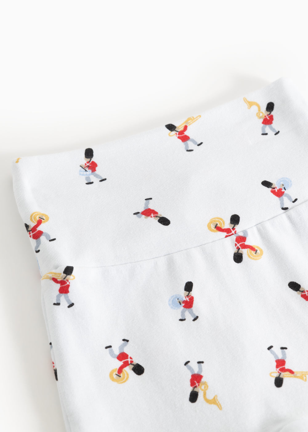 White pants with detailed musician print all over the fabric