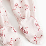 Light baby pants with red bow pattern and folded leg cuffs