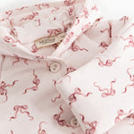 Rexa jumpsuit with hood: buttons on the collar, white with pink bows