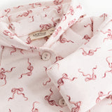 Rexa jumpsuit with hood: buttons on the collar, white with pink bows