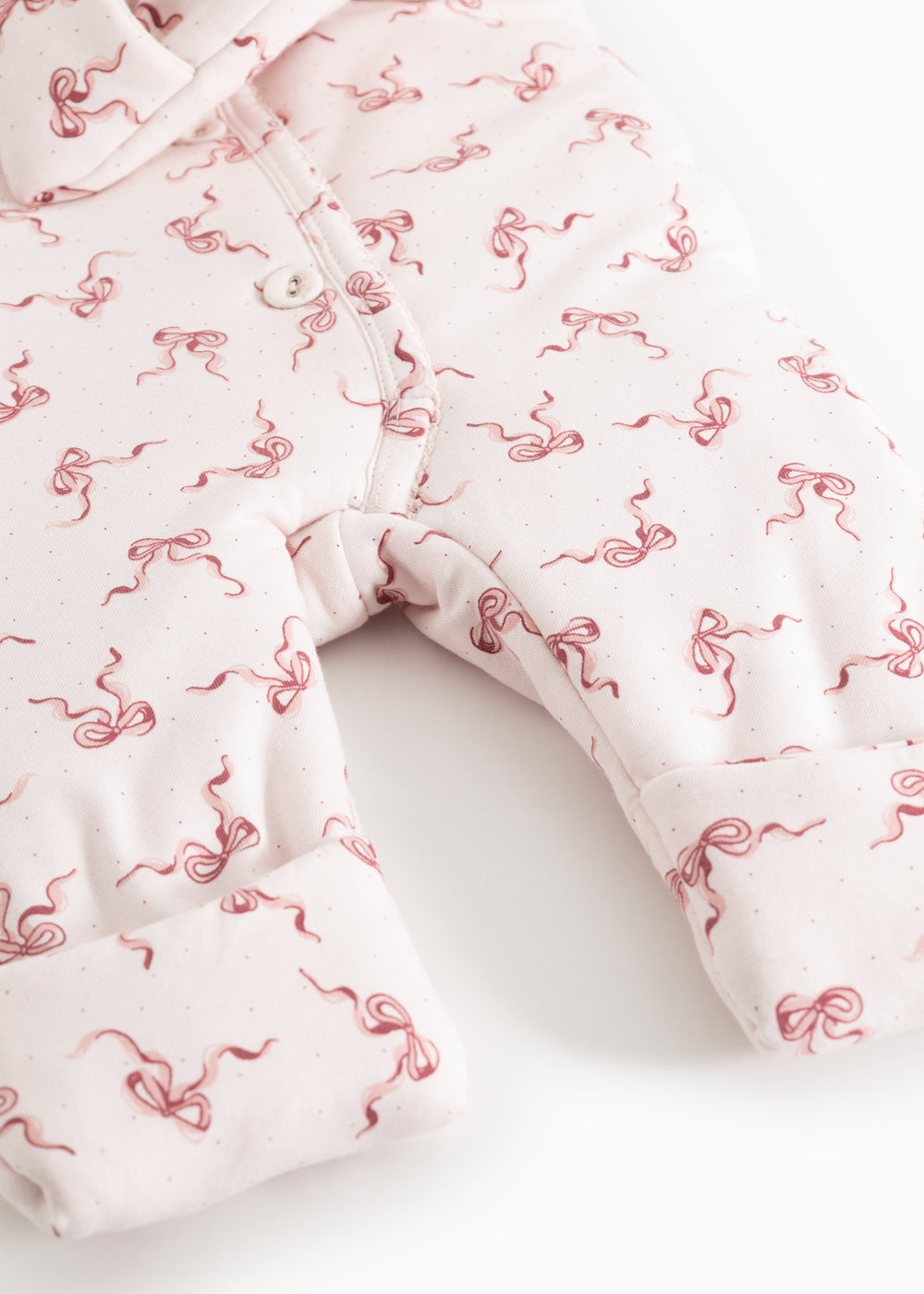 Rexa jumpsuit: legs with jumpsuit cut and ribbed edge, white with pink bows