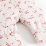 Rexa jumpsuit: legs with jumpsuit cut and ribbed edge, white with pink bows