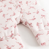 Rexa jumpsuit: legs with jumpsuit cut and ribbed edge, white with pink bows
