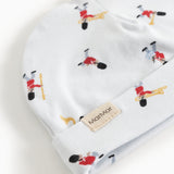 White baby hat with musician pattern and MarMar label