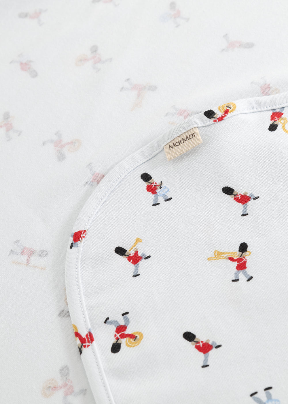 White rug with musician print, rounded edge and label tag