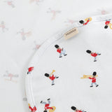 White rug with musician print, rounded edge and label tag