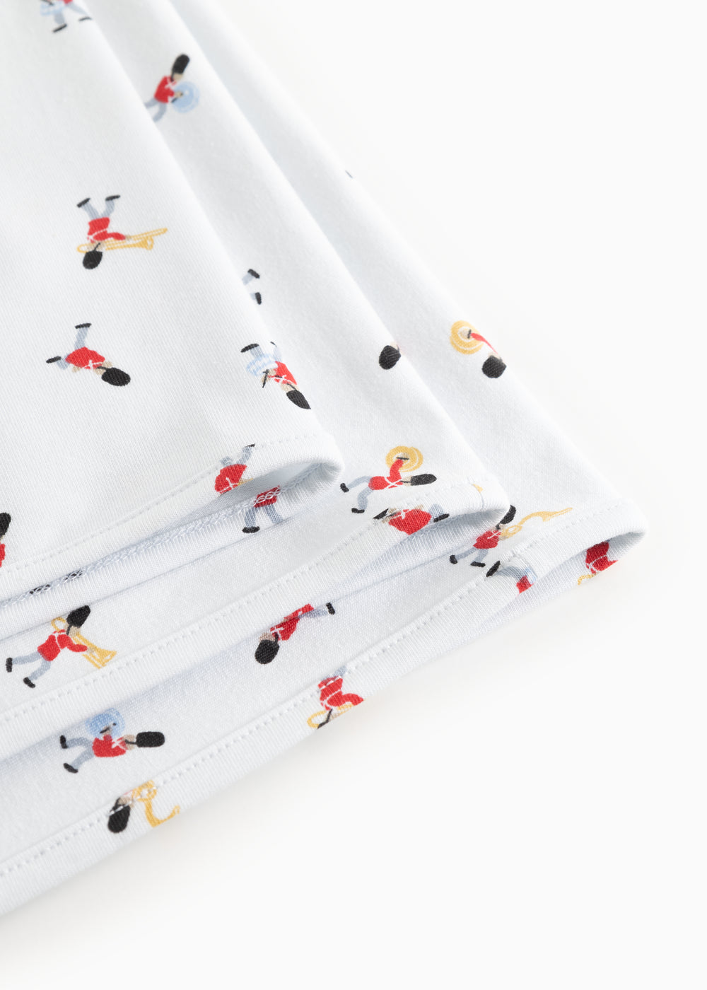 White rug with musician print and double-stitched edge