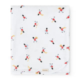 White rug with colorful musician figures in a repeated pattern