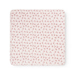 Rectangular rug with border, uniform pink bow pattern on light background
