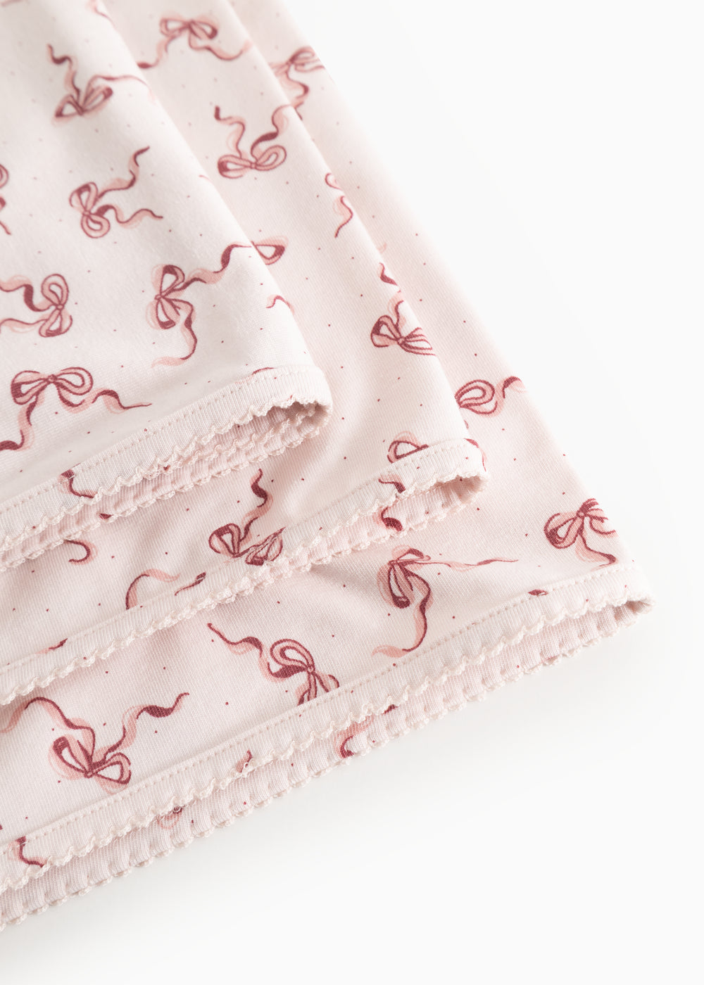 Carpet with nail edge and pink bow pattern