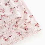 Carpet with nail edge and pink bow pattern