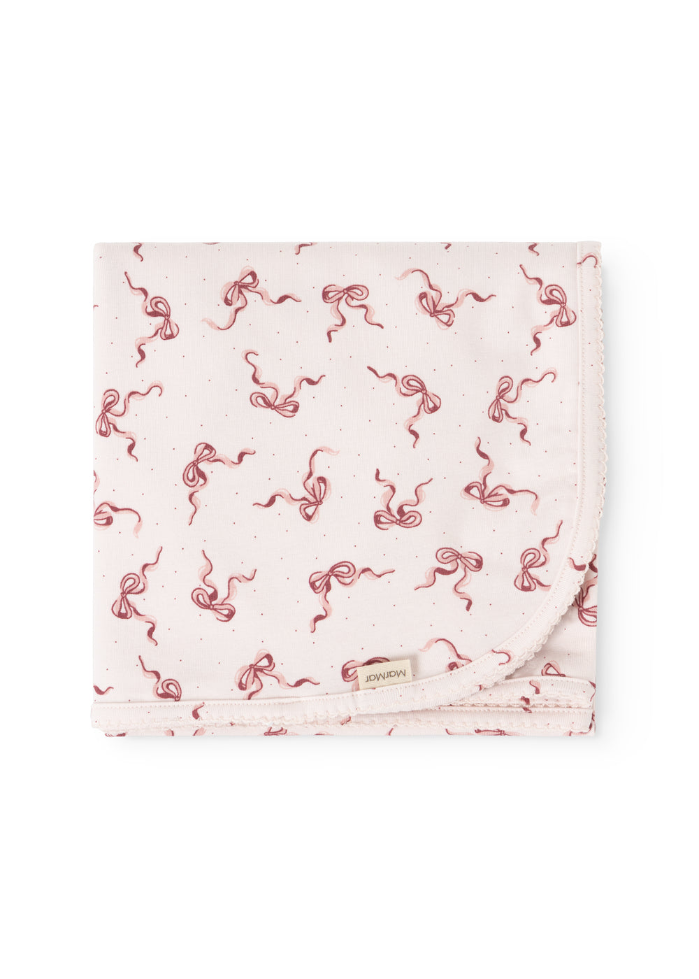 Rug folded as a rectangle, pink bow pattern on light background, seam edges