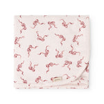 Rug folded as a rectangle, pink bow pattern on light background, seam edges