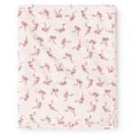 Carpet with light base and red bow pattern, edge with slight wave shape.