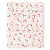 Carpet with light base and red bow pattern, edge with slight wave shape.
