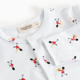 Jumpsuit with round white neckline and musician pattern with visible brand label