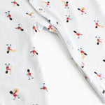 White cotton jumpsuit with musician motif and front button closure