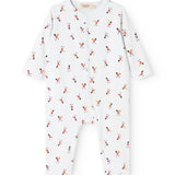 White jumpsuit with long sleeves and legs, round neck, and small musician motifs