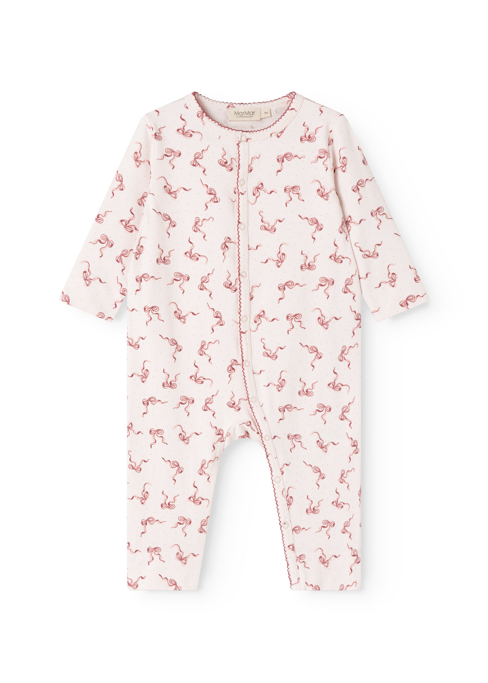 White jumpsuit with pink bow print and long sleeves, front button closure