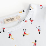 Detail of white pajamas with musician print at neckline and label tape