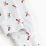 Close-up of cuff and hem on white pajamas with musician print